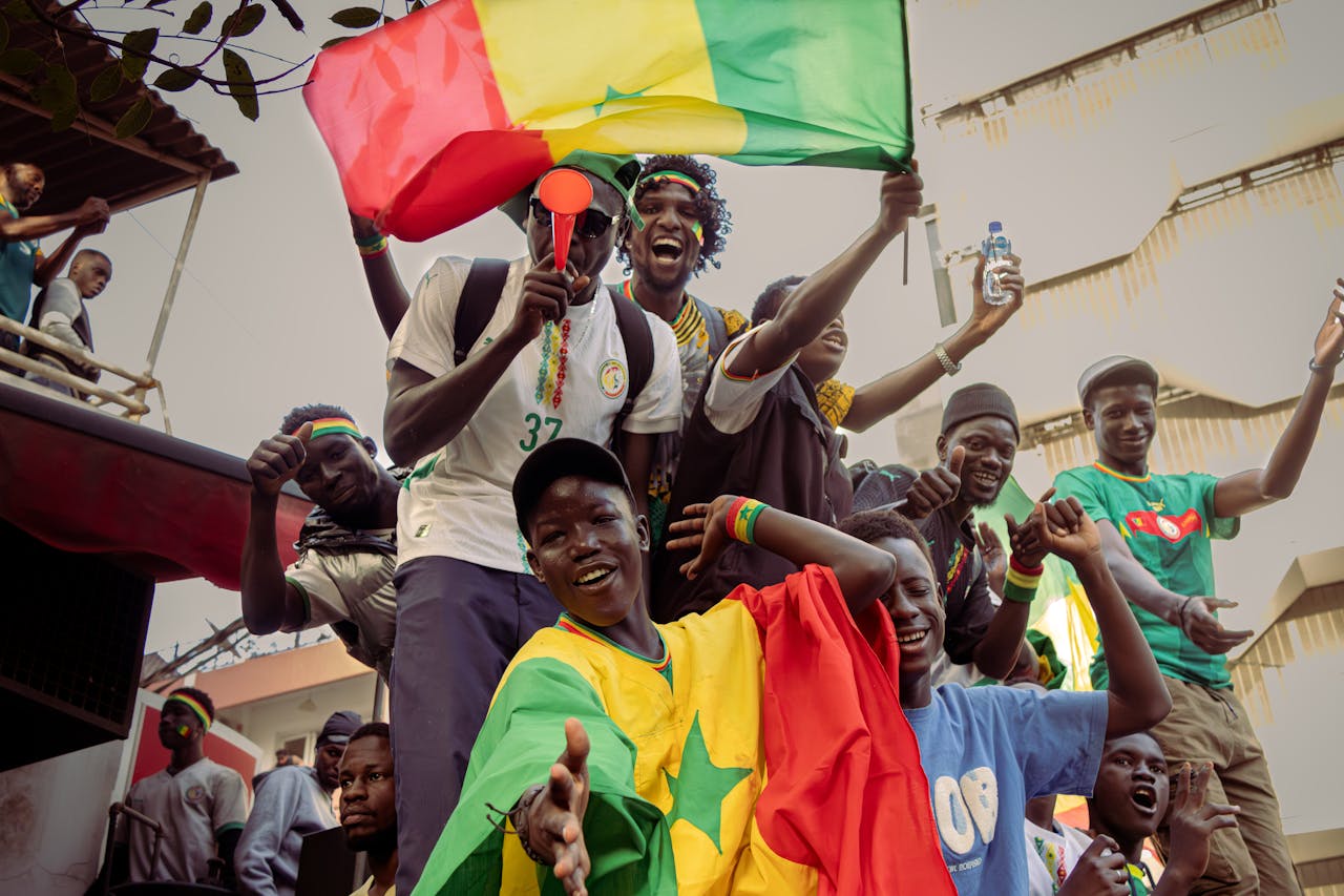 services-02 A lively group of people celebrating with vibrant Senegal flags. Joyful and colorful scene.